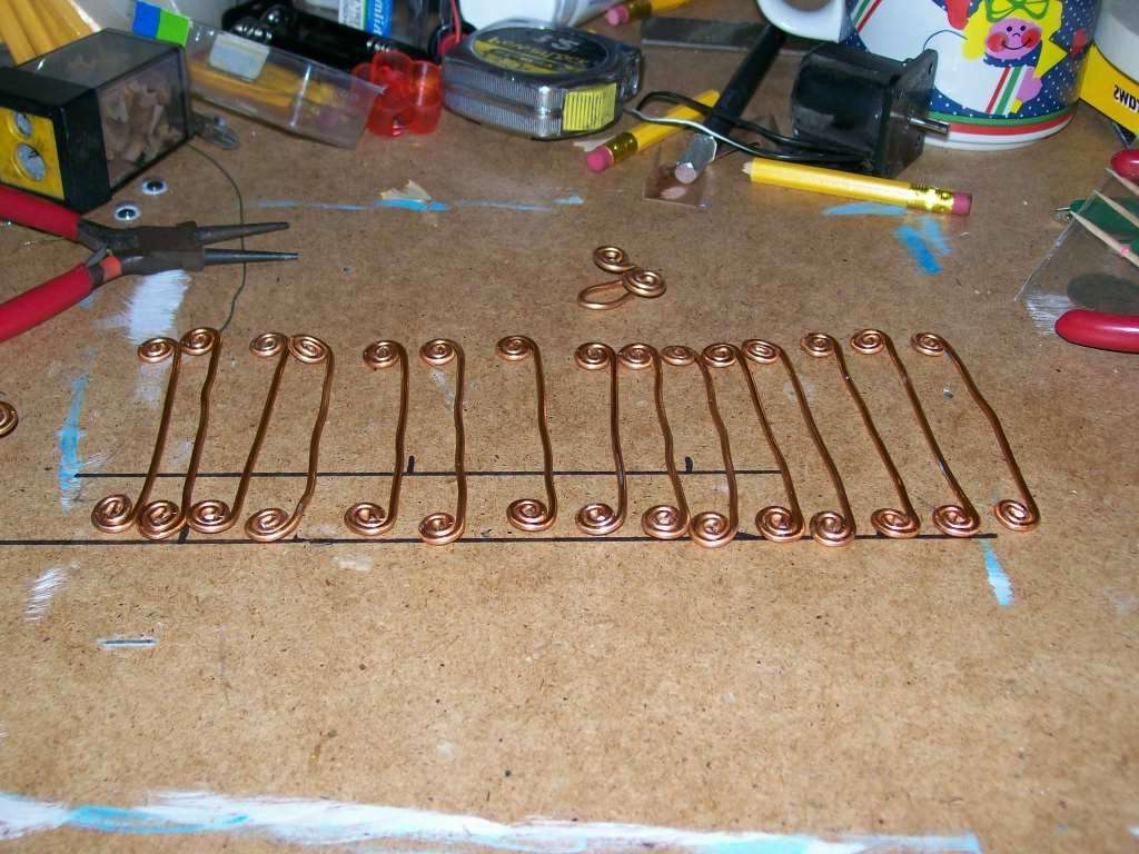 You need to prepare in advance the same lengths of wire, which you will then tighten with round-nose pliers. The bracelet looks like hooks connected to each other.