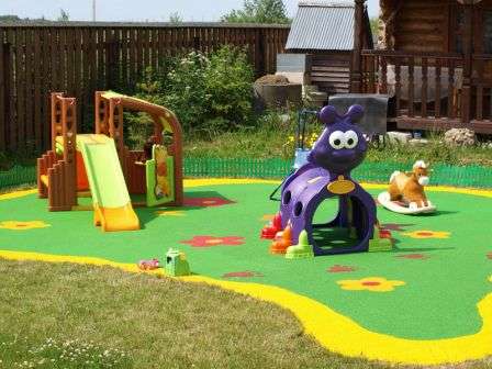 The location of the playground for children in front of the house will be the most successful, since parents can control their child from the windows