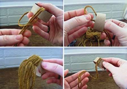 When you are finished with the threads, you need to tuck the loose ends inside the cardboard ring, and tie them into a bundle on the back side.