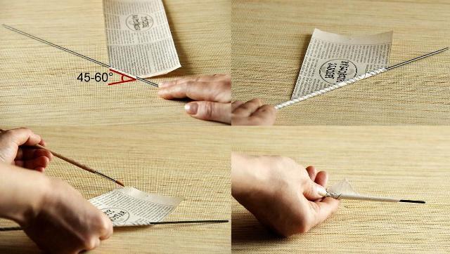 Start winding newspaper strips on a skewer, and so that the tube does not unfold, grease the tip with glue