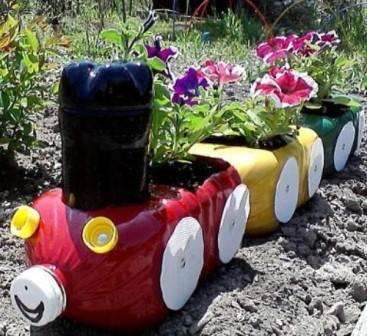 flower pots from plastic bottles look original in the garden. You can make a cut in prices