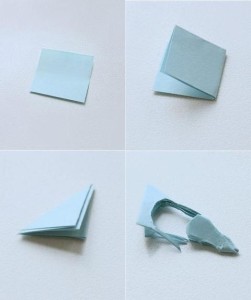 Spread one side of the pigeon with glue, attach the thread to the center and press down with the other side of the pigeon.