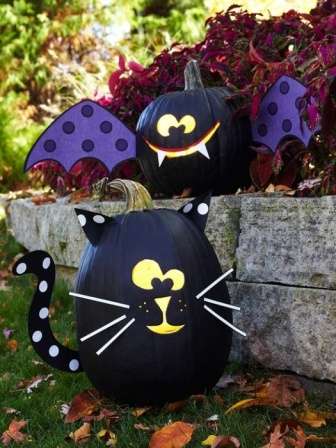 To decorate the bat, paint the pumpkin with matte black paint and glue paper wings to the vegetable