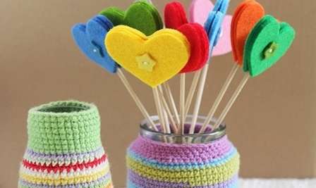 You can use a hot glue gun to glue cut felt hearts onto bamboo kebab sticks.